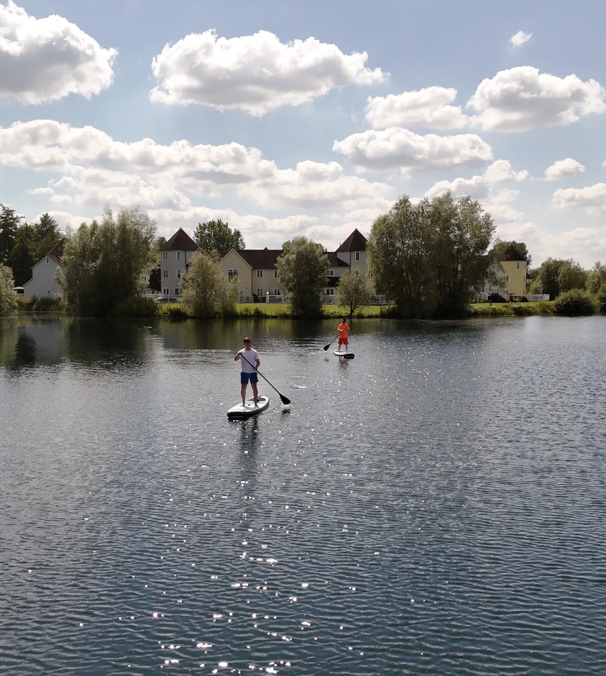 A paddleboarder out on Windrush Lake