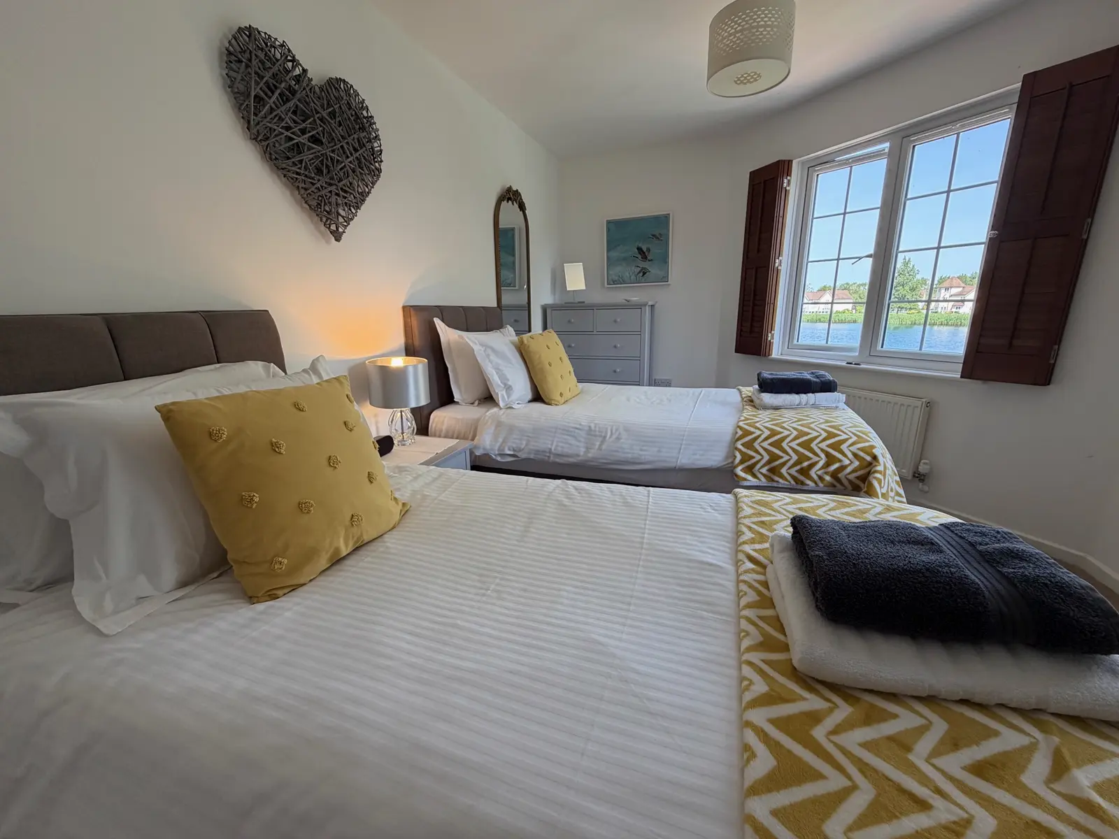 Bedroom two with twin beds at Grey Heron Lodge