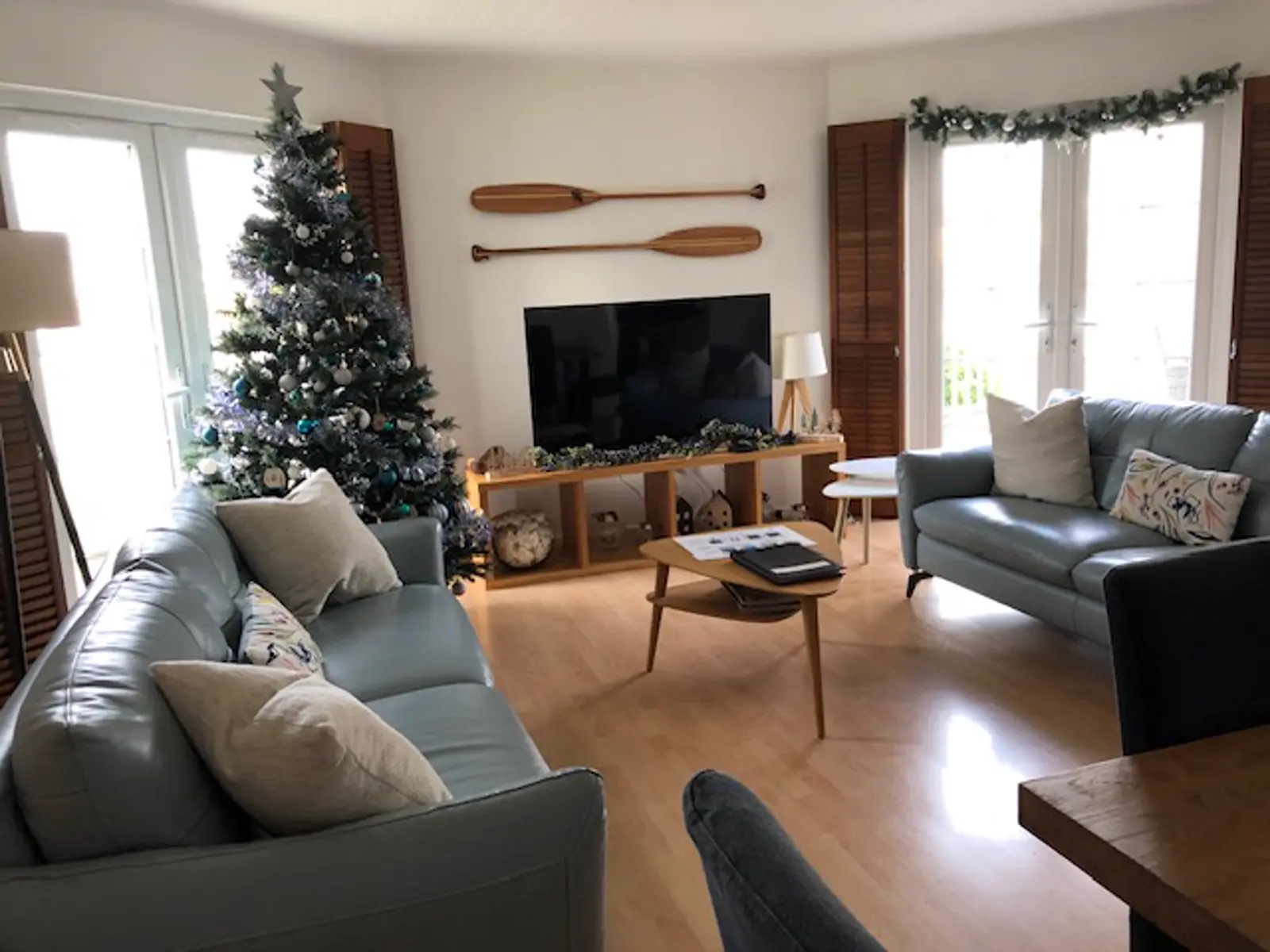 The living room decorated for Christmas at Grey Heron Lodge
