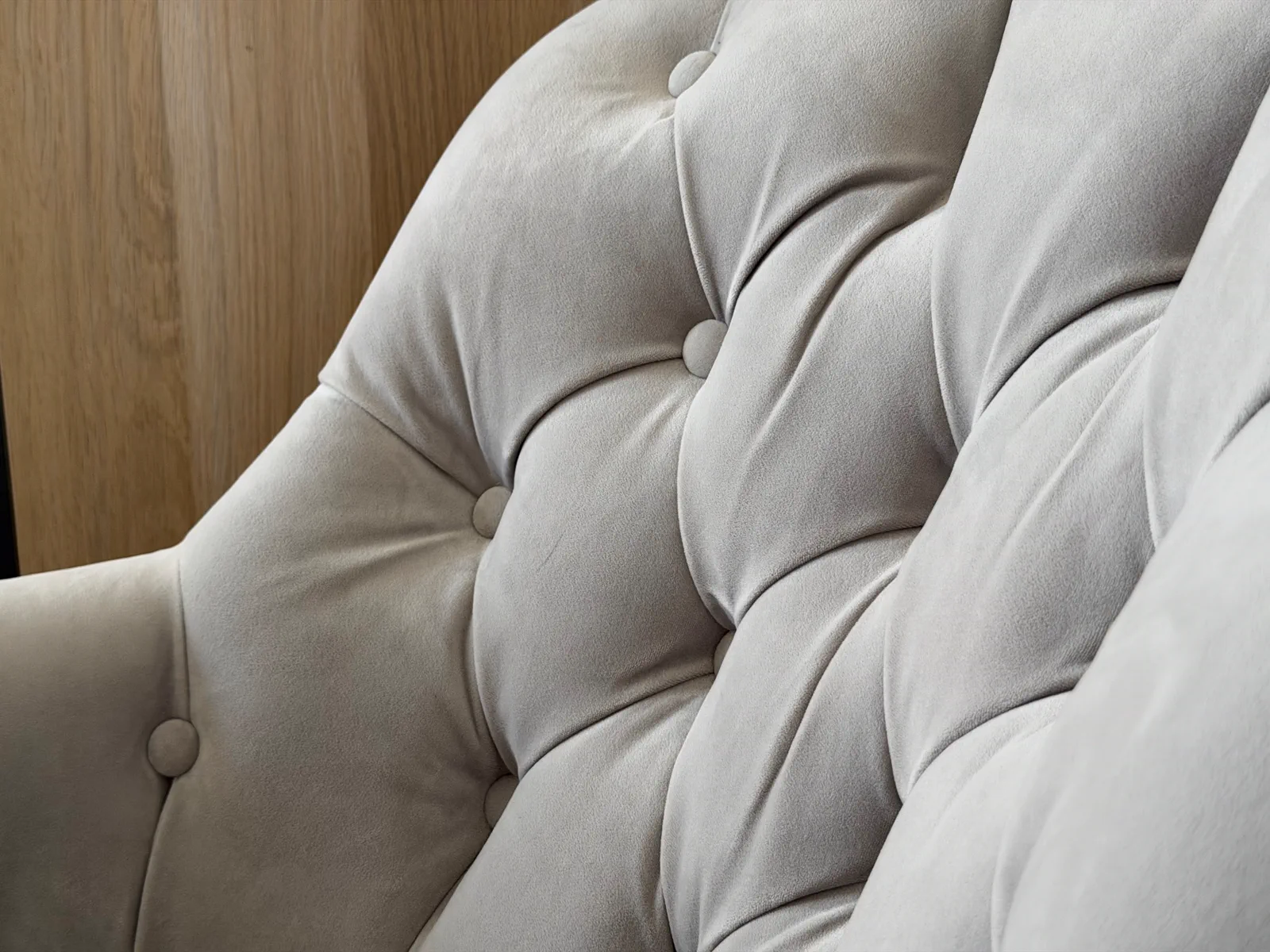 A styled reading chair in Bedroom 2 at Grey Heron Lodge