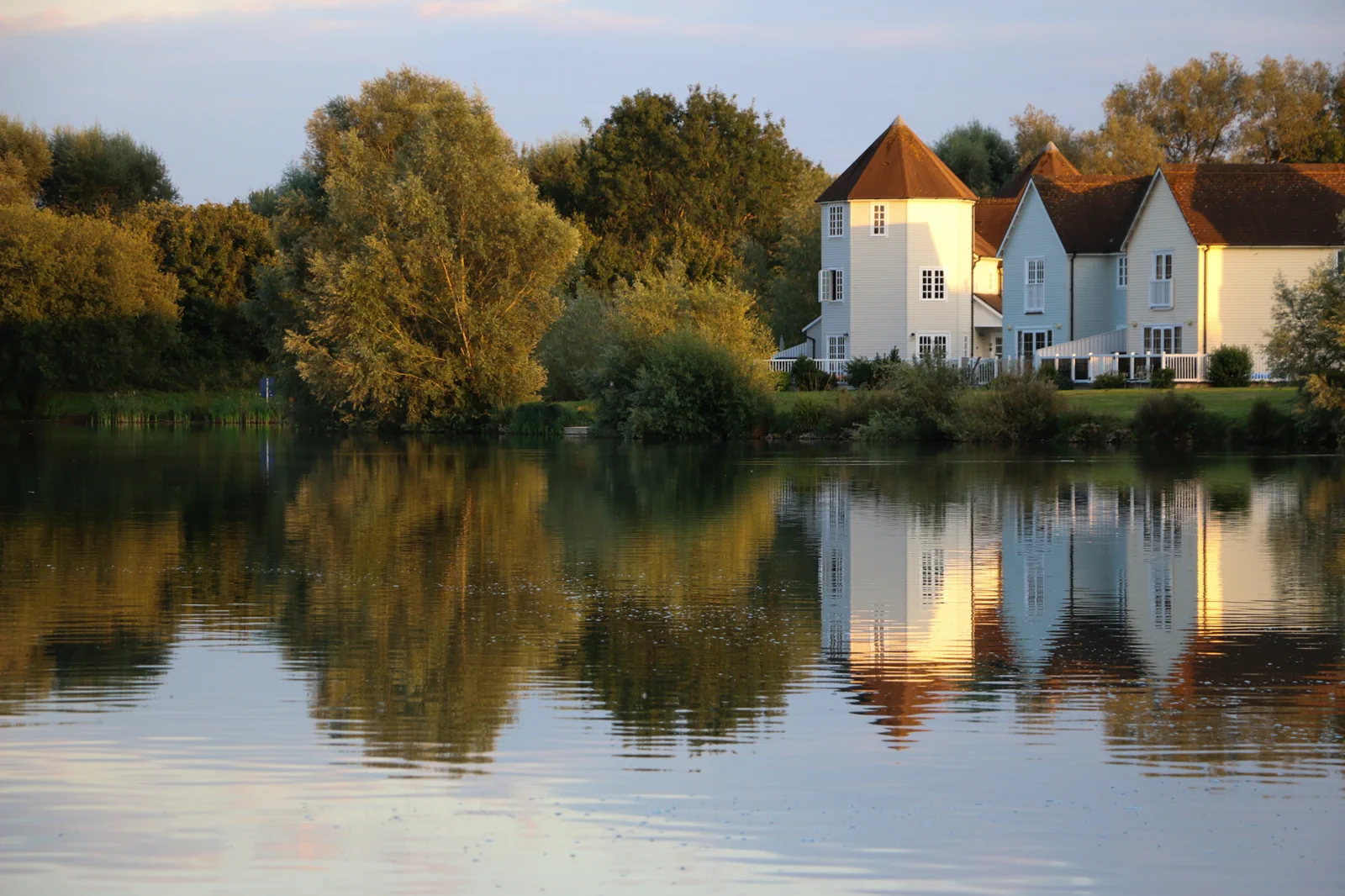 The view out across Windrush Lake from Grey Heron Lodge