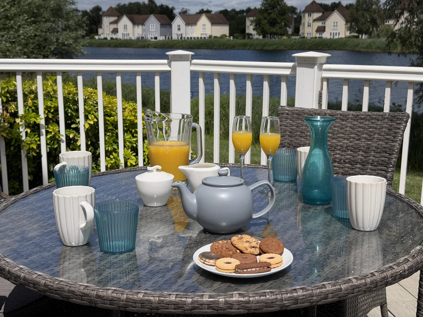 An outdoor dining table set up on the deck at Grey Heron Lodge