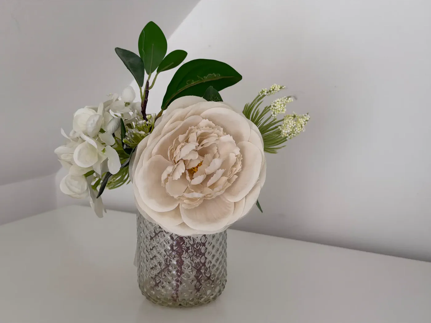 Fresh flowers styled in Bedroom 2 at Green Woodpecker Lodge