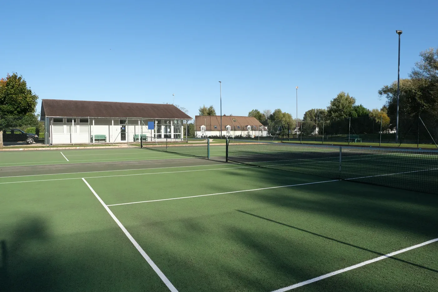 The tennis courts a short walk from Green Woodpecker Lodge