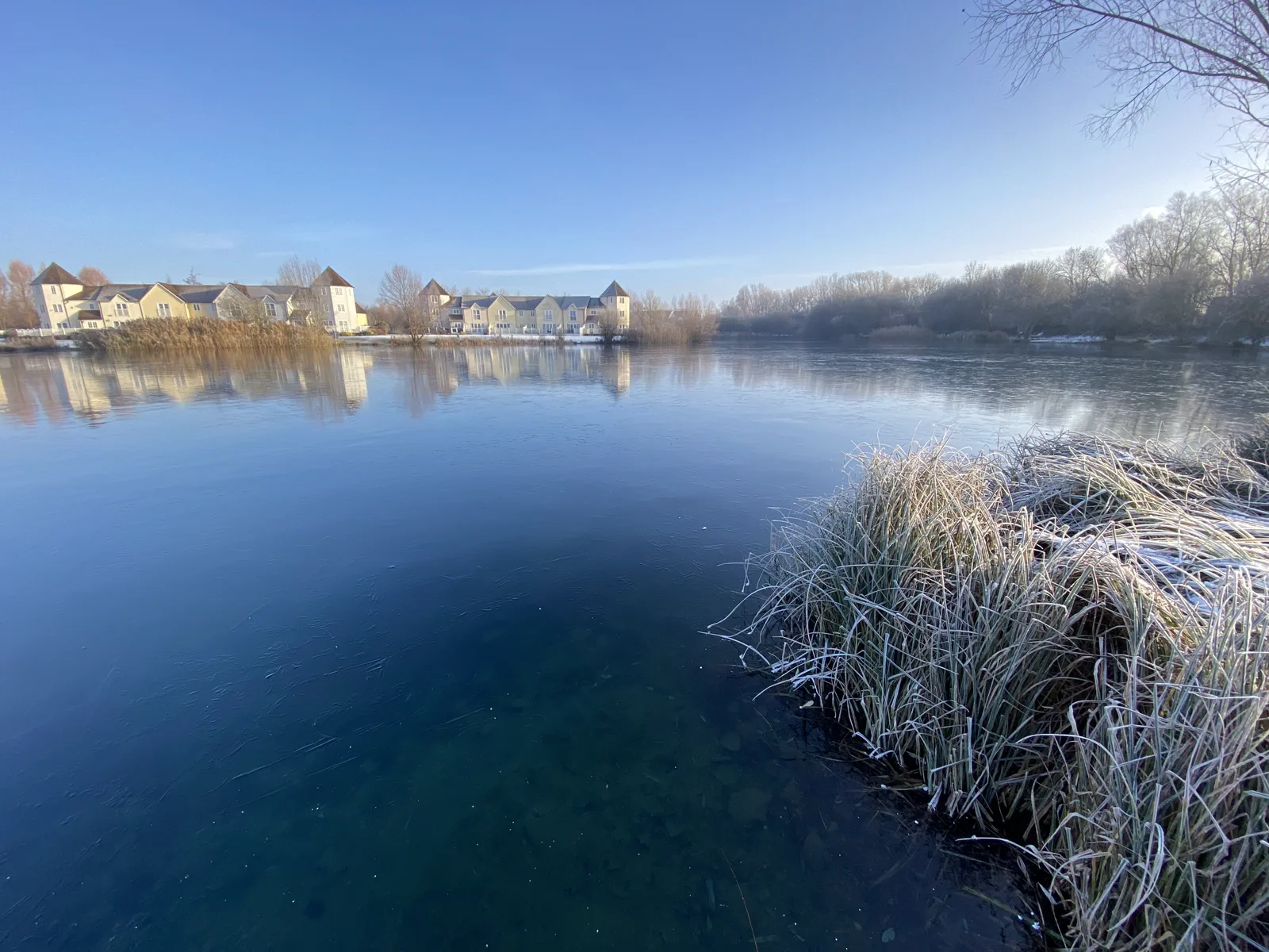 Ice covering the surface of Windrush Lake in winter