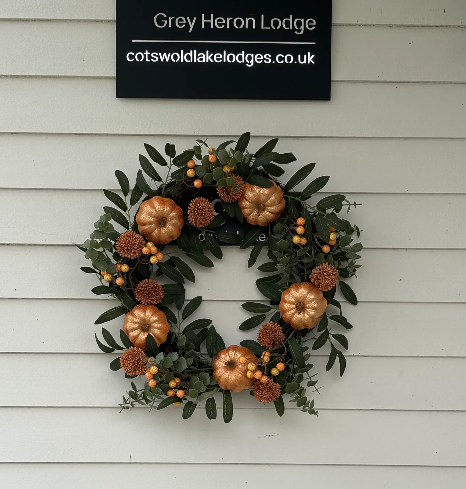 An autumn wreath on the door at Grey Heron Lodge