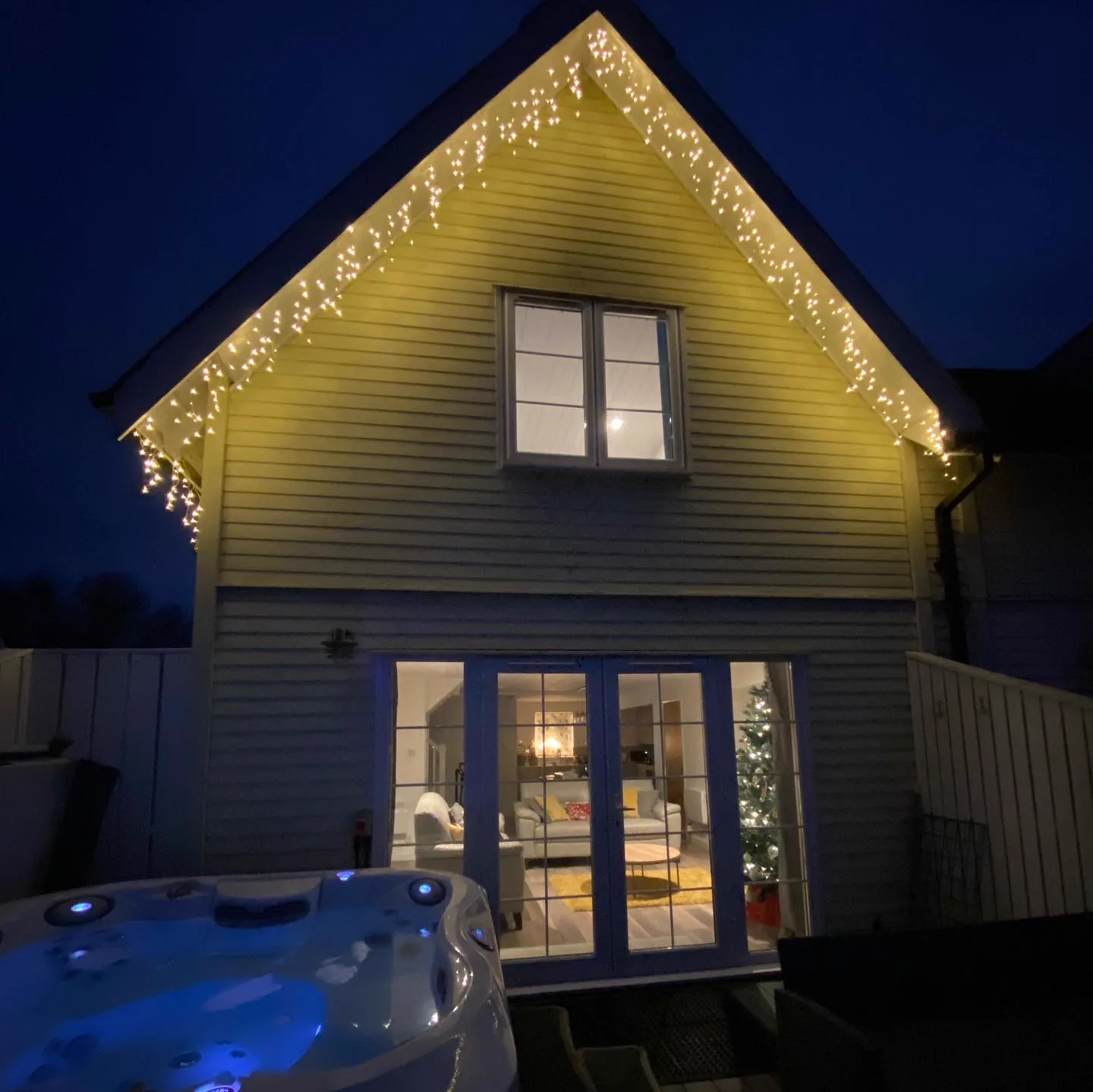 Green Woodpecker Lodge decorated with christmas lights